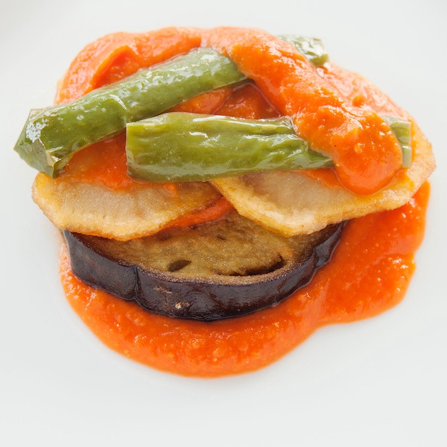 Tumbet. Islas Baleares, frito de verduras
Layers of fried vegetables with tomato sauce