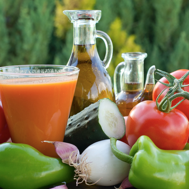 still life for a salad with vegetables, olive oil and vinegar